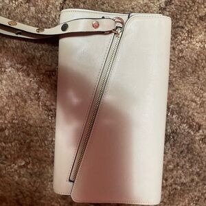 Cream colored wristlet.